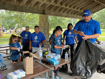 24 employee volunteers of Culligan of Kansas City scoured Frisco Lake Park in Olathe, KS for their trash cleanup mission